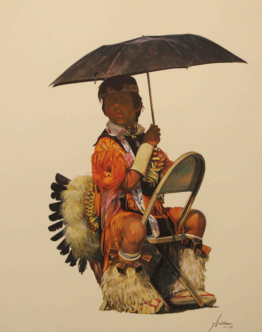 Young native american boy in his dance attire resting on a chair.